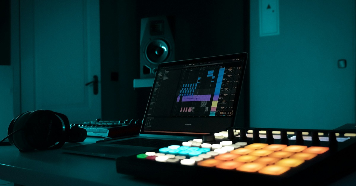 Ableton Live session view showing color-coded audio and MIDI tracks with return channels