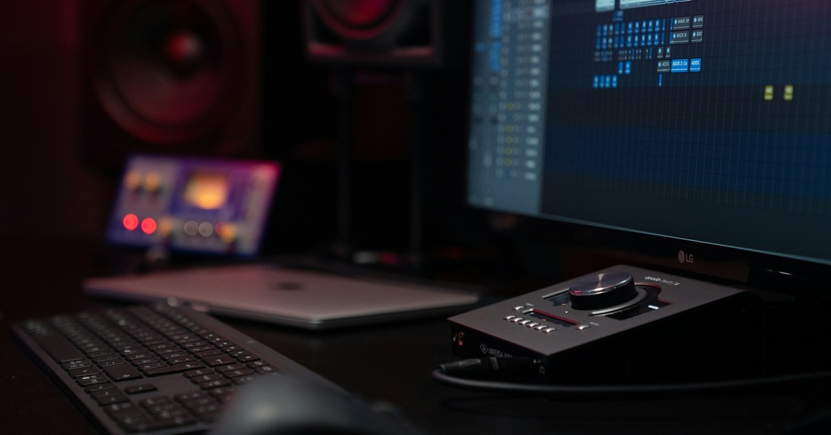 Universal Audio Apollo Twin X audio interface on a professional studio desk with cables and monitor