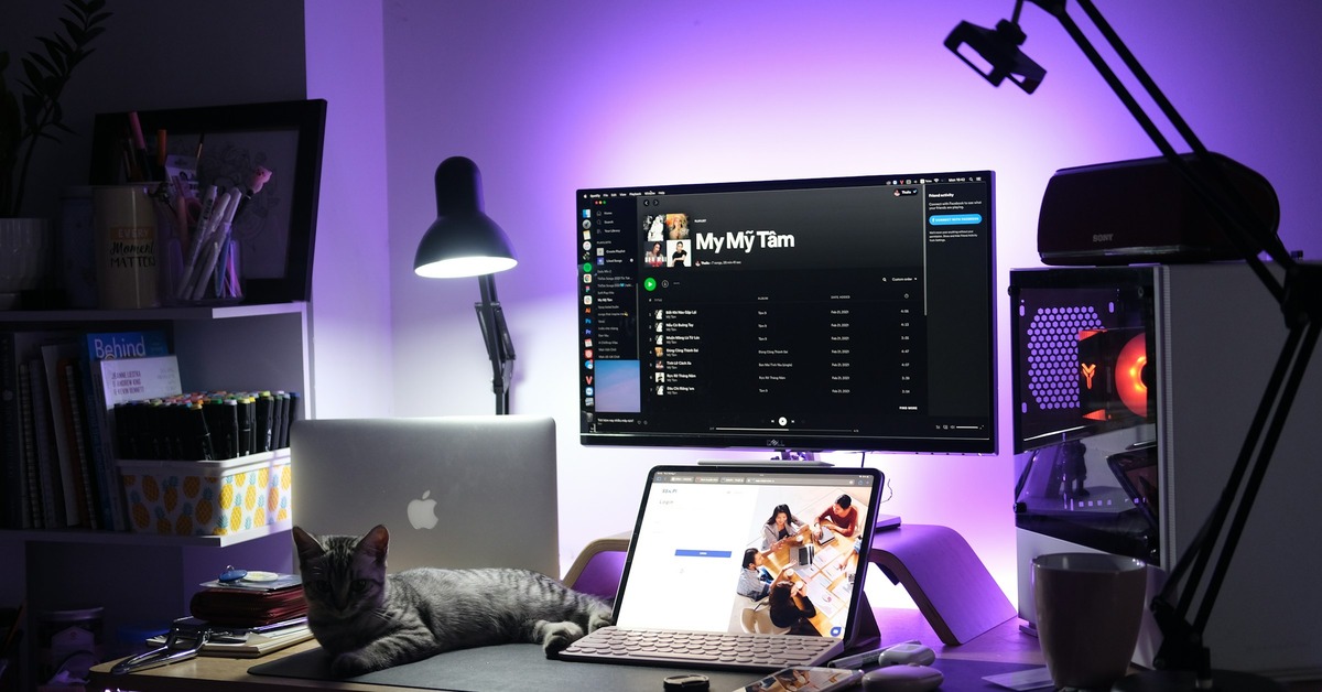 A beginner DJ controller setup on a desk with a laptop and headphones