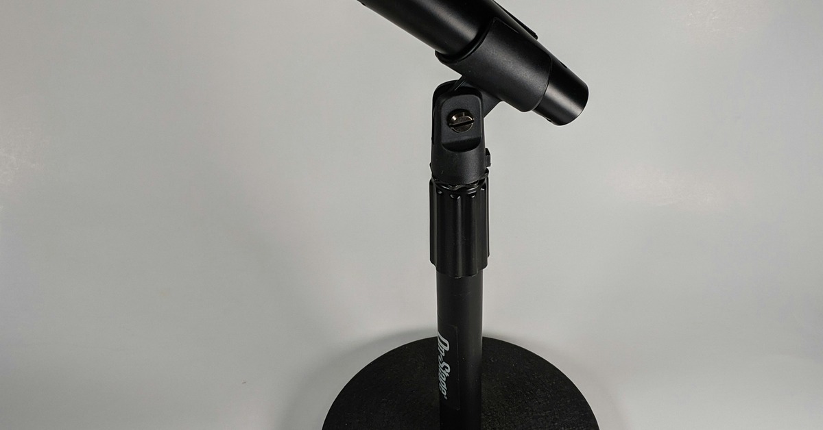 Shure SM7B microphone set up on a desk in a home recording studio