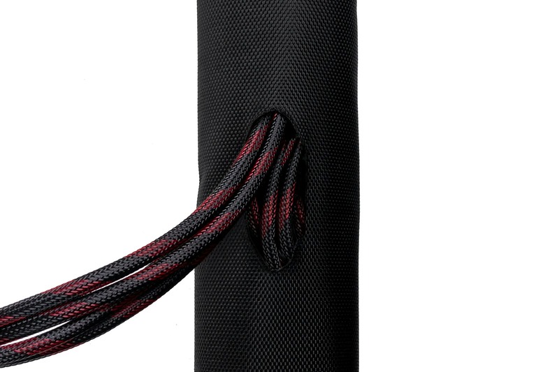 Interior of a DJ bag showing high-density foam padding, cable straps, and zippered mesh pockets