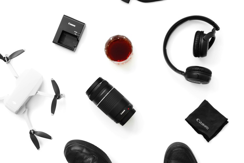 DJ headphones and a compact controller packed in a padded carry-on bag