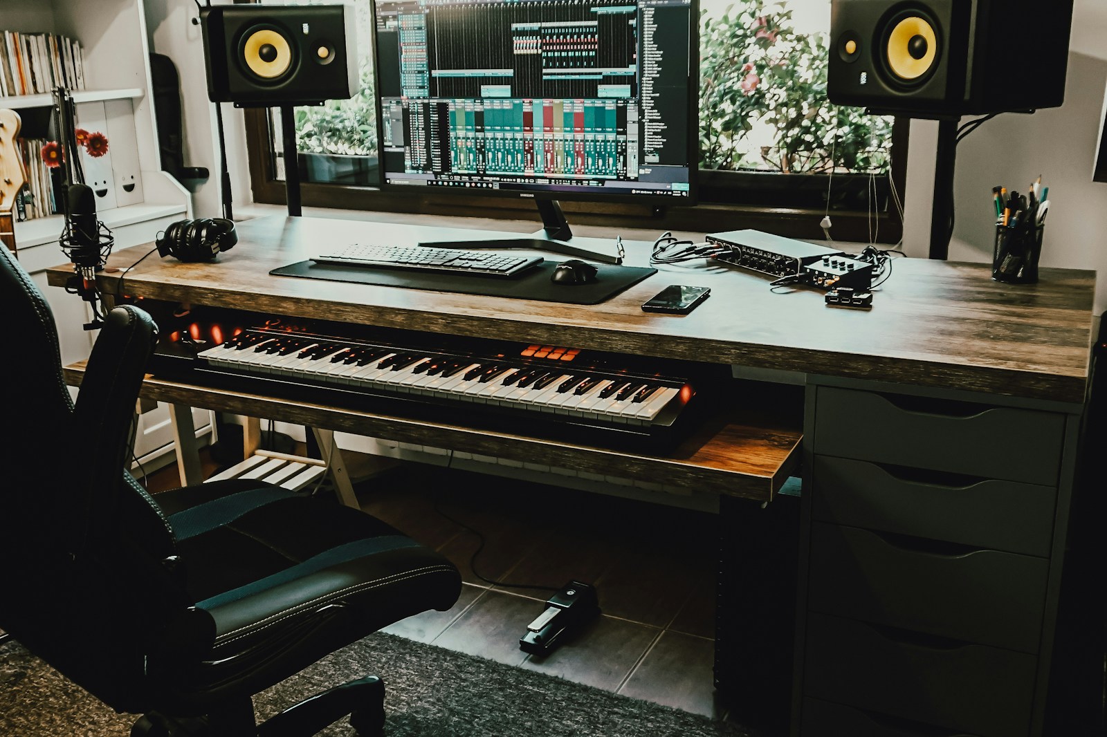 Comparison shot of a home studio desk showing incorrect monitor positioning before and corrected positioning after