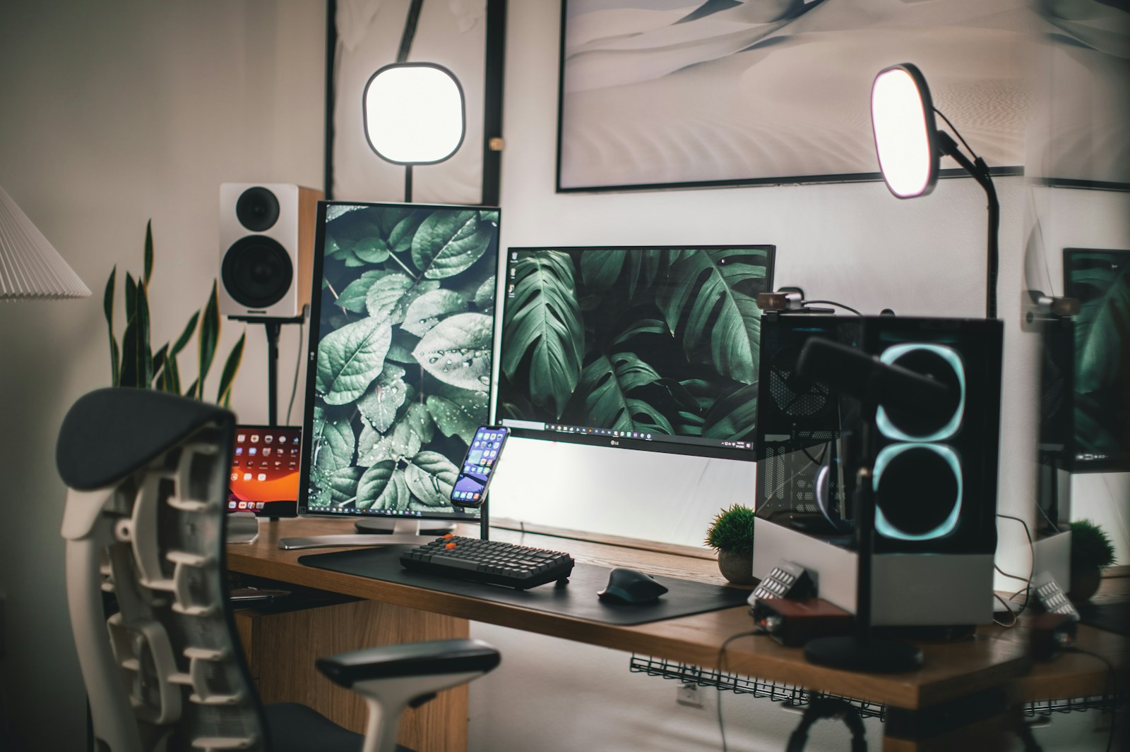 A well-organized home studio desk with studio monitors, acoustic panels on the wall, and a computer setup for recording and mixing.