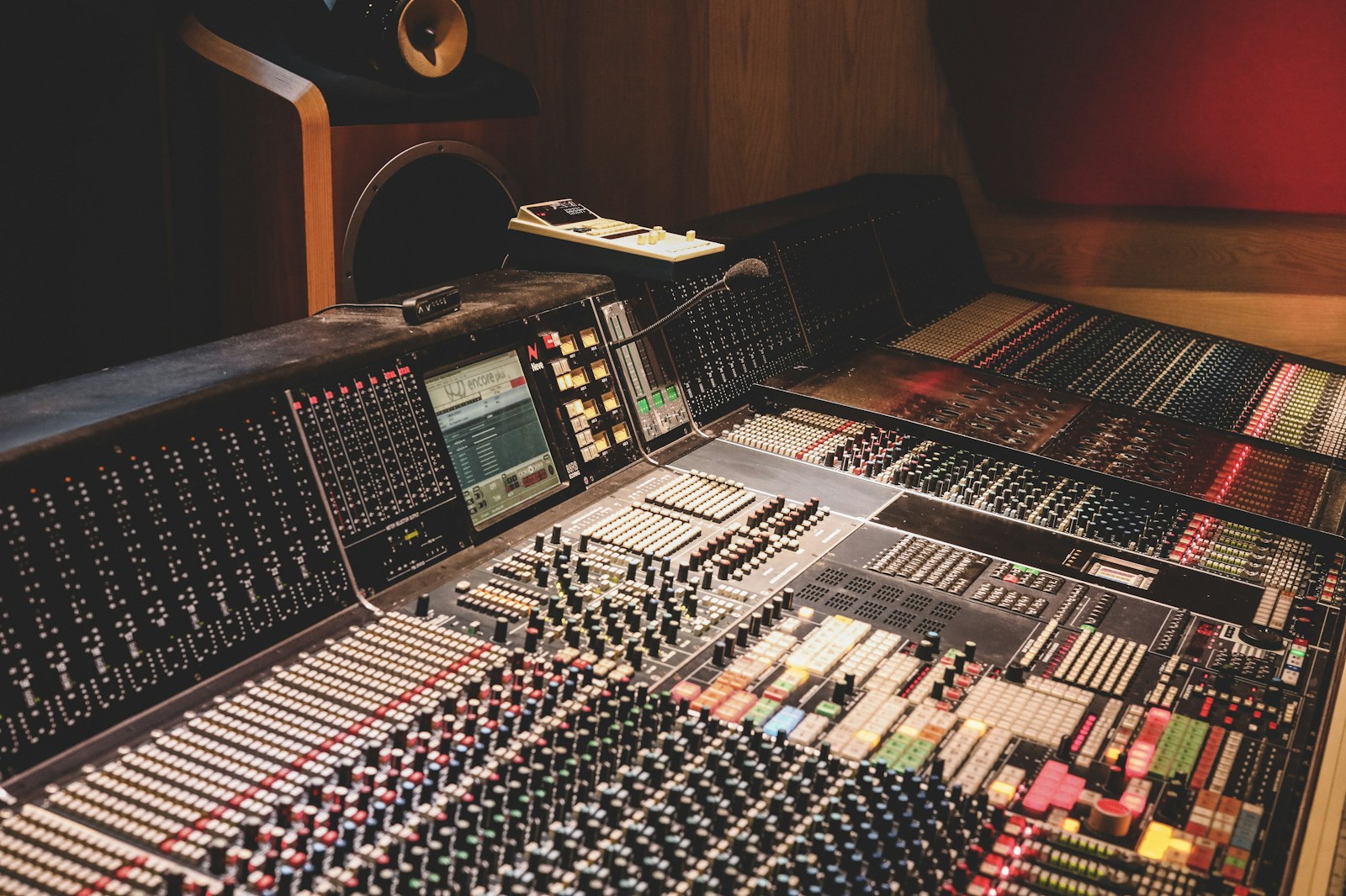 professional recording studio desk with studio monitors and analog outboard gear