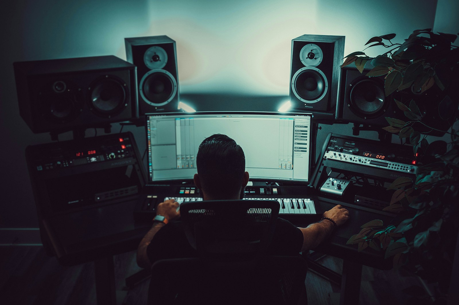 Diagram showing studio monitor placement with an equilateral triangle for the listening position and marked first reflection points on side walls.
