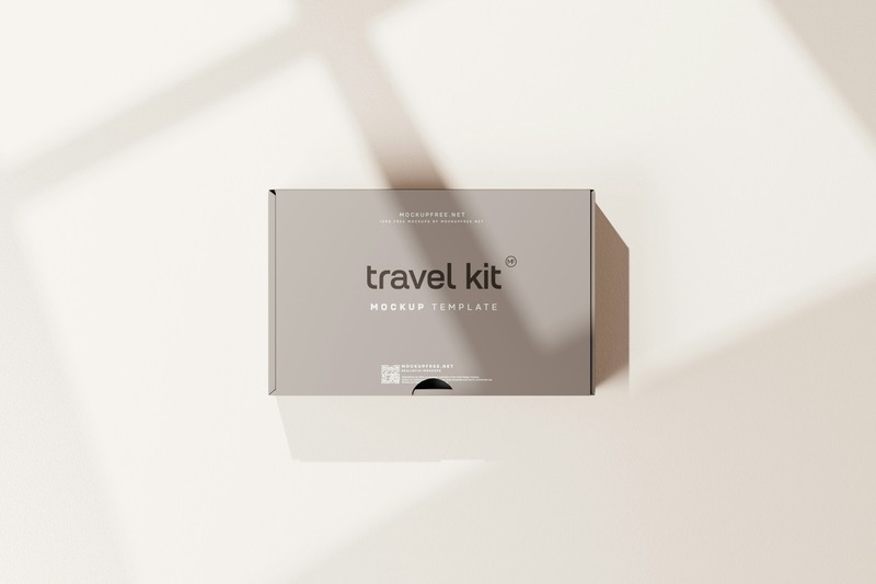 Travel sleep kit with silk eye mask and earplugs on a hotel bed