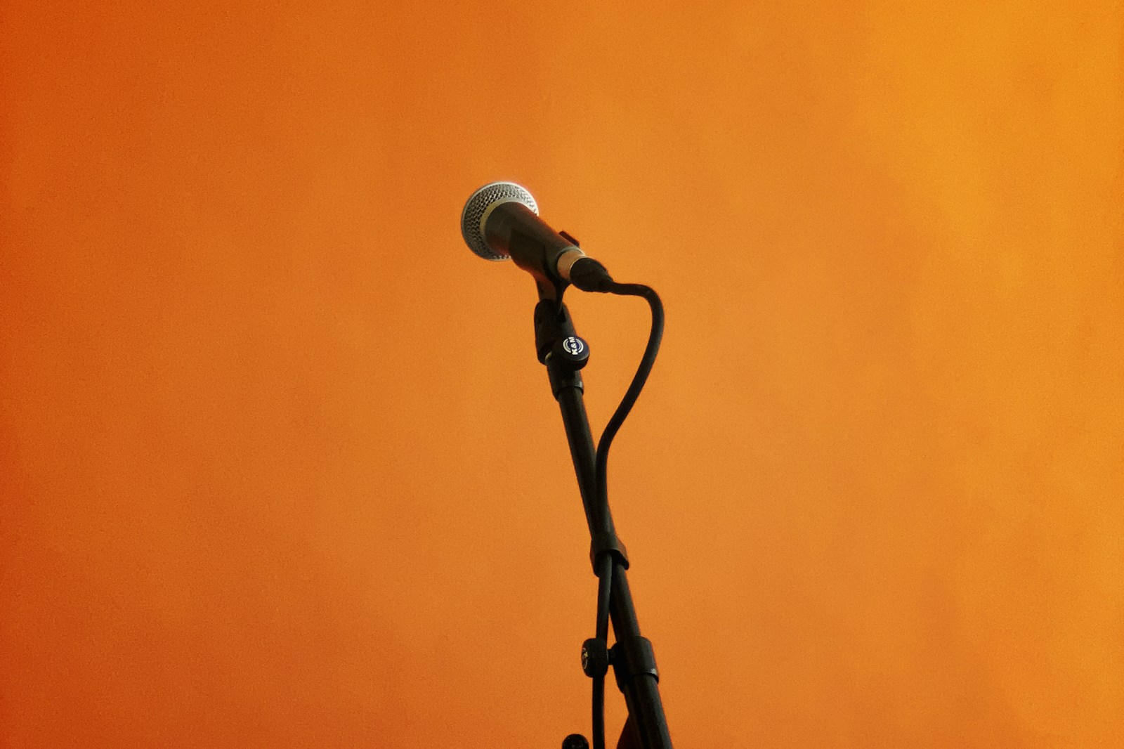 warm glowing vacuum tube microphone in a recording session with ambient lighting