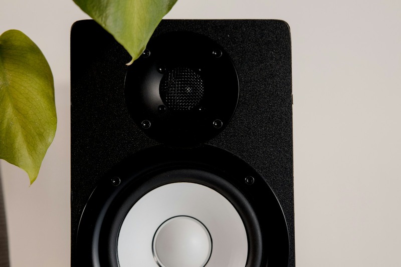 Pair of Yamaha HS8 studio monitor speakers on desk with audio interface